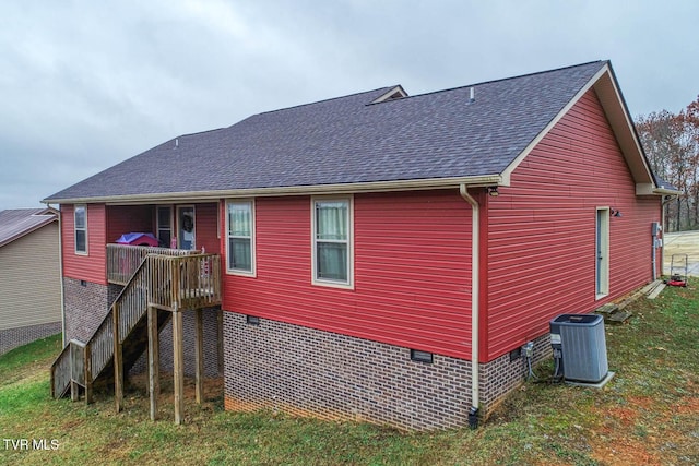 back of house featuring central air condition unit