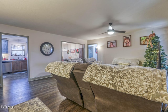 bedroom featuring sink, ensuite bath, ceiling fan, dark hardwood / wood-style flooring, and a closet