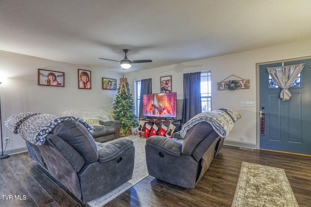 living room with ceiling fan and dark hardwood / wood-style floors