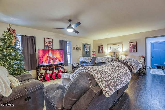 bedroom featuring ceiling fan and dark hardwood / wood-style floors