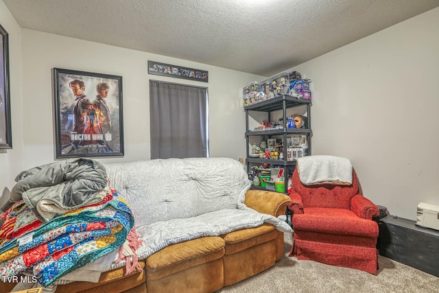 living area with a textured ceiling and carpet floors