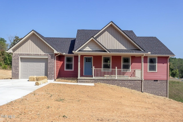 view of front facade with a porch and a garage