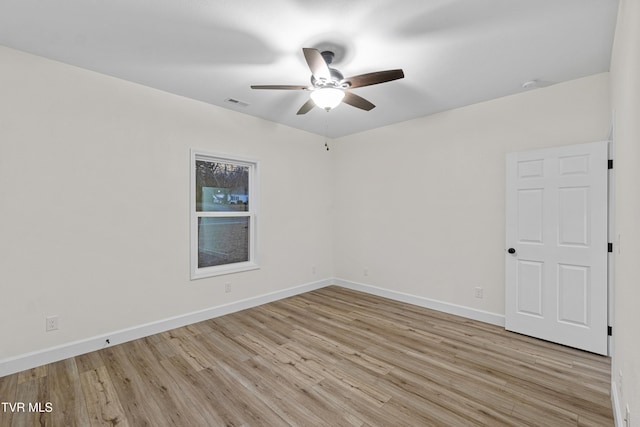 unfurnished room featuring ceiling fan and light hardwood / wood-style flooring