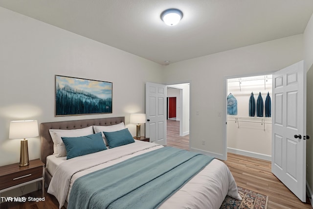 bedroom with hardwood / wood-style flooring