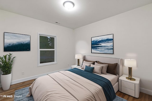 bedroom with wood-type flooring