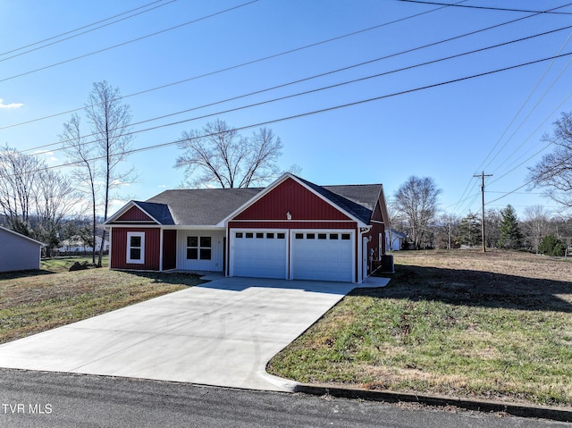 view of front of property with a garage and a front lawn