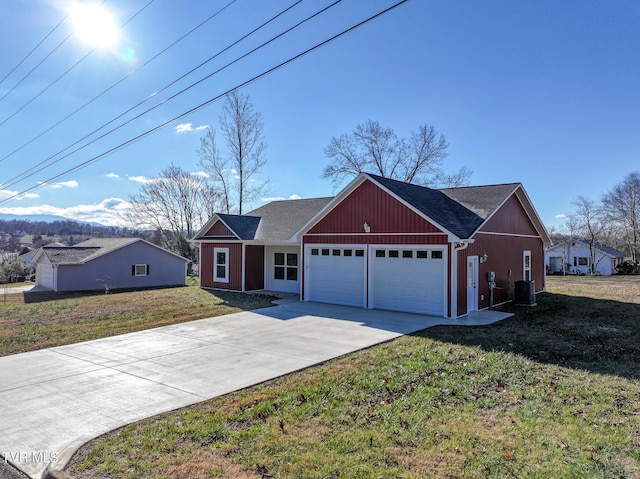 ranch-style house featuring central AC unit, a front yard, and a garage