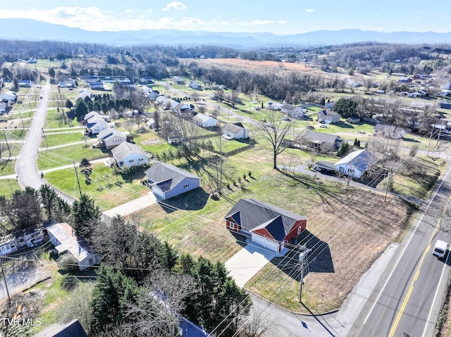 drone / aerial view featuring a mountain view