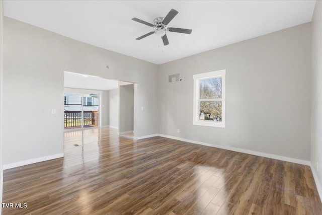 spare room featuring dark hardwood / wood-style floors and ceiling fan