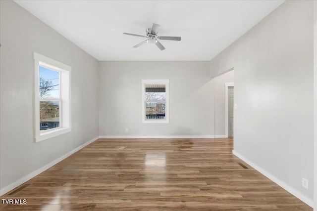 unfurnished room with hardwood / wood-style floors and ceiling fan