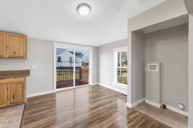 unfurnished dining area featuring hardwood / wood-style floors