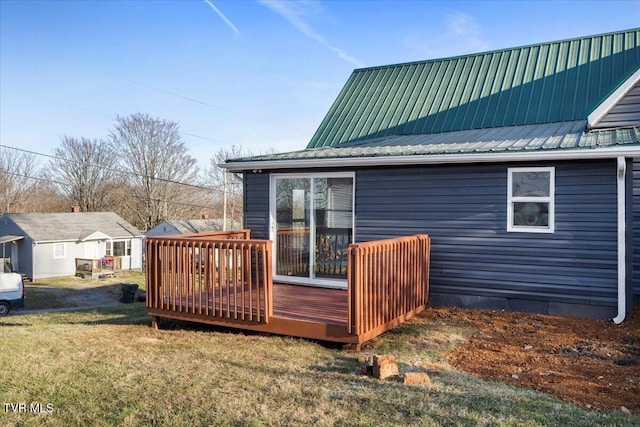 wooden deck with a lawn