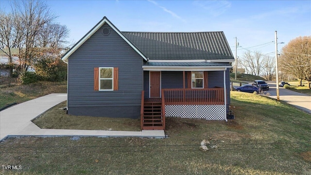 exterior space with covered porch and a front yard