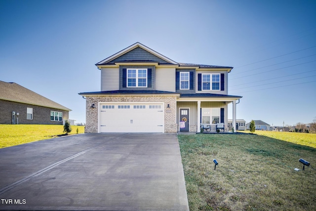 view of front of home featuring a porch, a front yard, and a garage