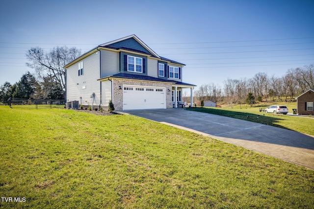 view of front of property with a front yard and a garage