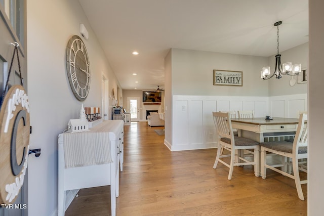 dining space featuring a notable chandelier and light hardwood / wood-style flooring