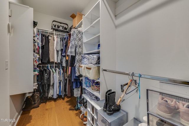 walk in closet featuring hardwood / wood-style floors