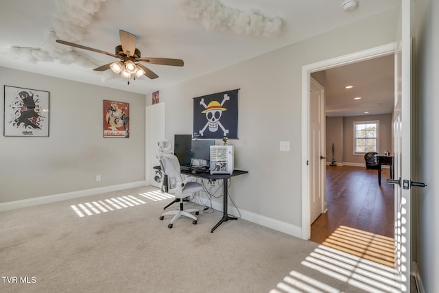 office space with ceiling fan and carpet floors