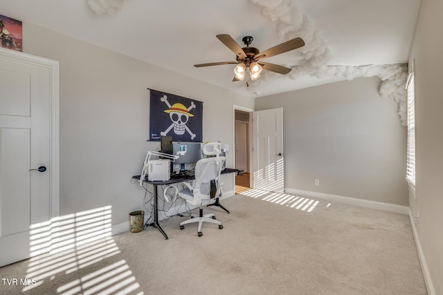 carpeted office with ceiling fan