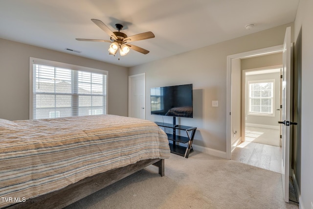 carpeted bedroom with ceiling fan