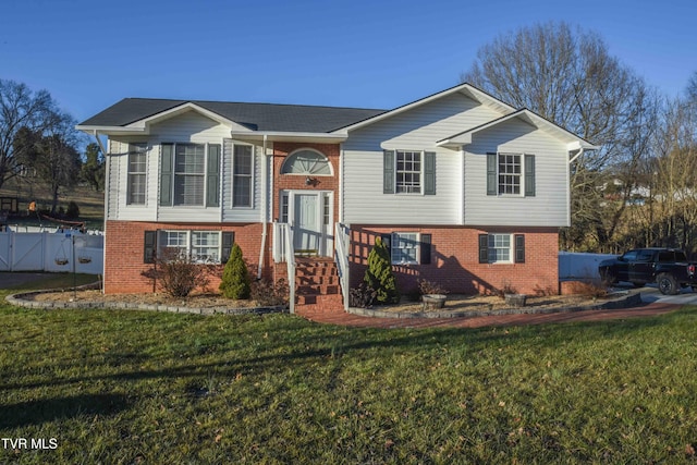 bi-level home with a front yard