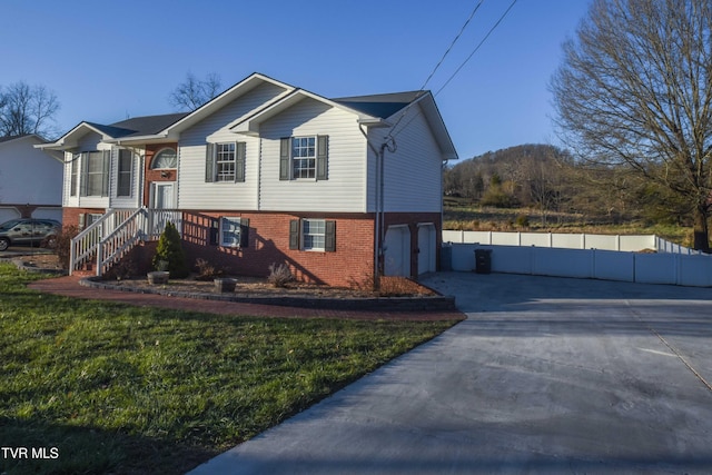 view of front of home featuring a garage and a front lawn