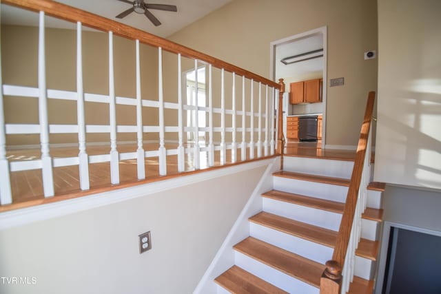 staircase with ceiling fan