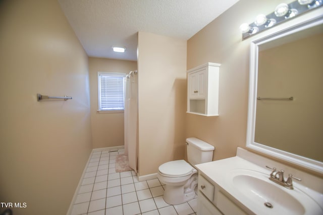 bathroom featuring tile patterned flooring, a textured ceiling, vanity, and toilet