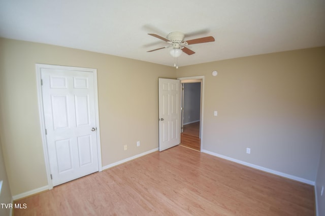 unfurnished bedroom featuring ceiling fan and light hardwood / wood-style floors