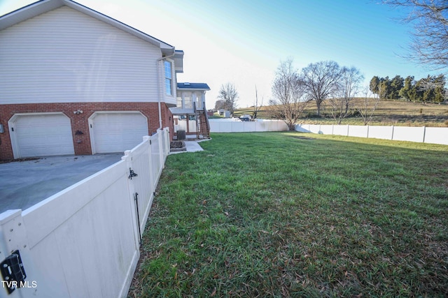 view of yard with a garage