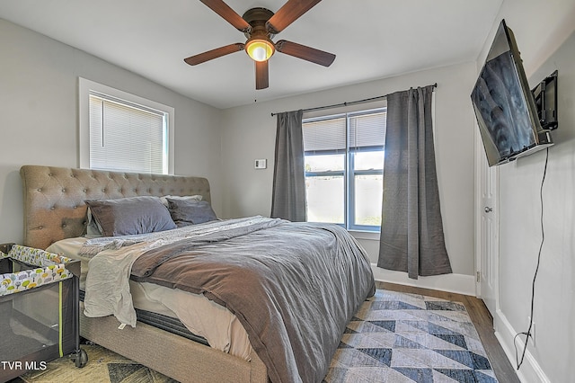 bedroom featuring ceiling fan and hardwood / wood-style floors