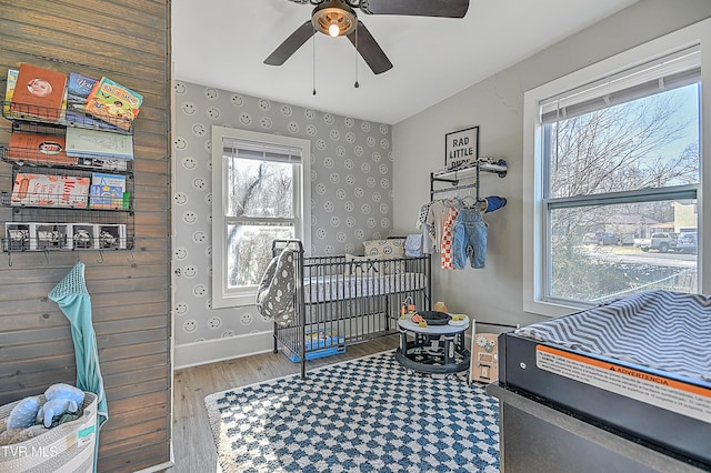 bedroom featuring wood-type flooring and ceiling fan