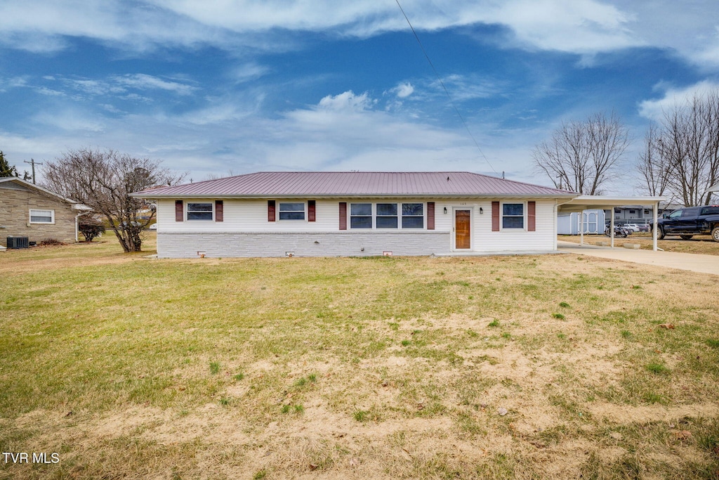 ranch-style house with a carport and a front lawn