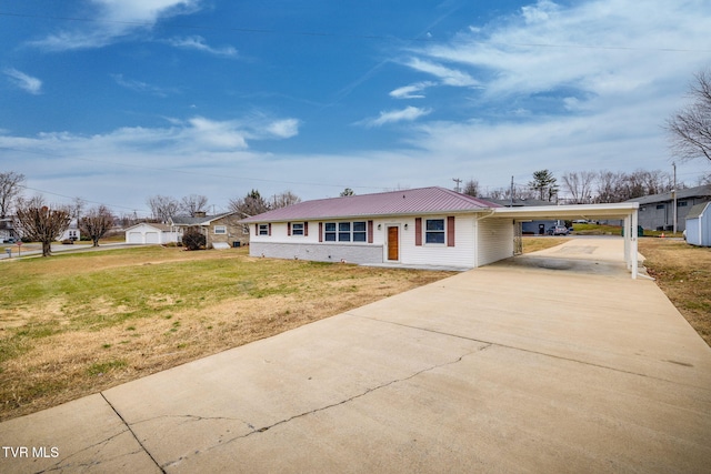 ranch-style home featuring a front yard and a carport