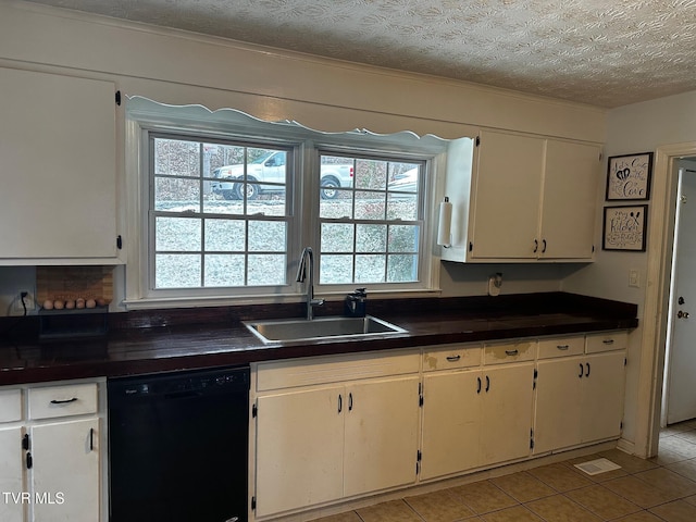 kitchen with a textured ceiling, dishwasher, white cabinetry, and sink