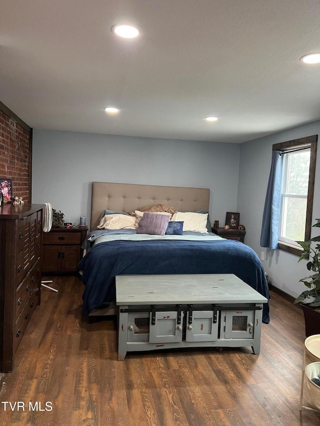 bedroom featuring dark hardwood / wood-style floors