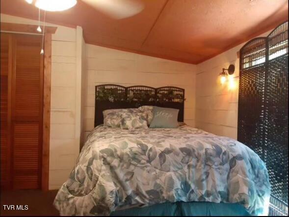 bedroom featuring lofted ceiling