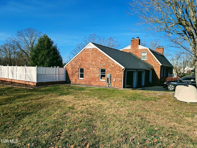 back of house with a yard