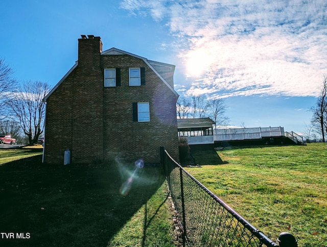 view of home's exterior with a yard