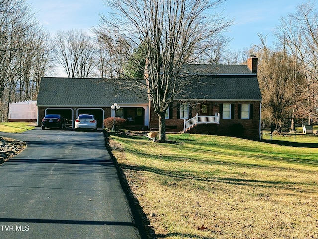 single story home featuring a garage and a front yard