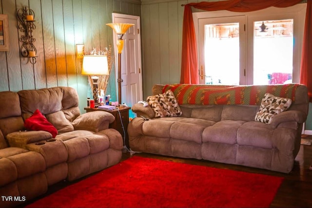 living room with wood walls