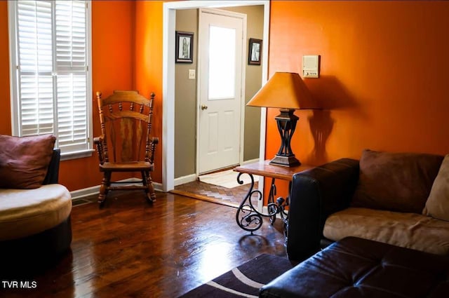 living room featuring dark wood-type flooring