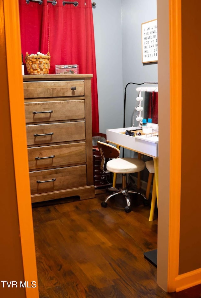 home office with dark wood-type flooring