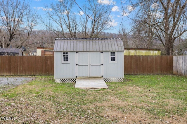 view of outbuilding featuring a yard