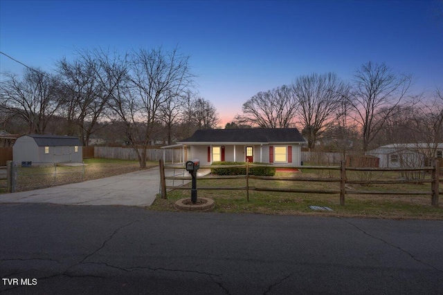 ranch-style house featuring a storage shed