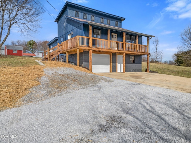 view of front of house featuring a garage and a deck