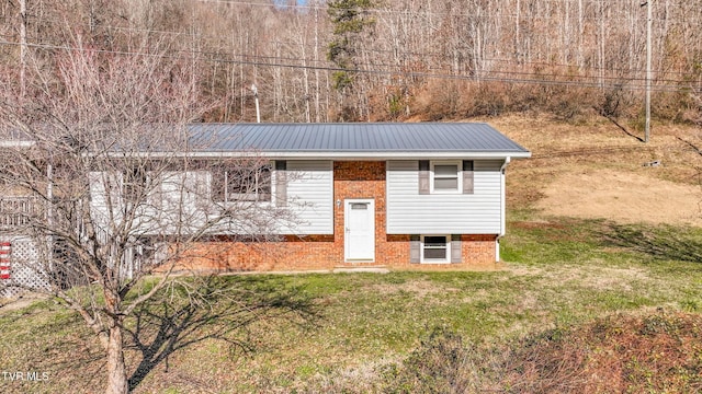 view of outbuilding with a yard