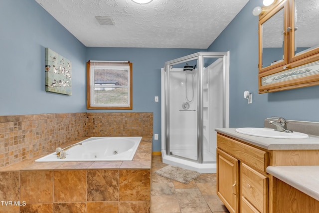 bathroom featuring vanity, a textured ceiling, and plus walk in shower