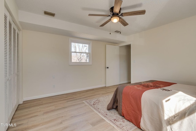 bedroom featuring ceiling fan and light wood-type flooring