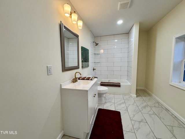 full bathroom with vanity, toilet, and tiled shower / bath combo